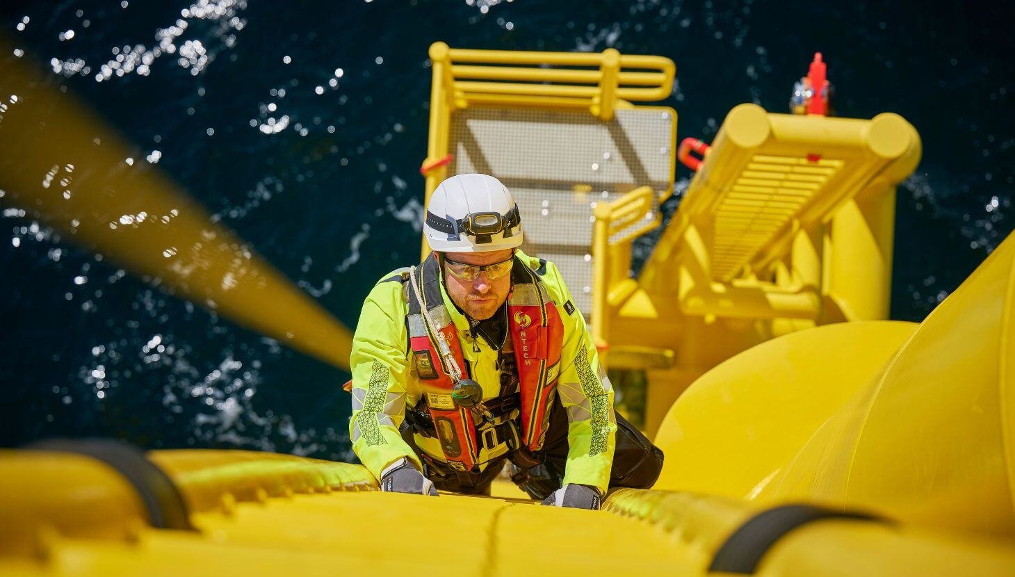 OEG worker climbing turbine