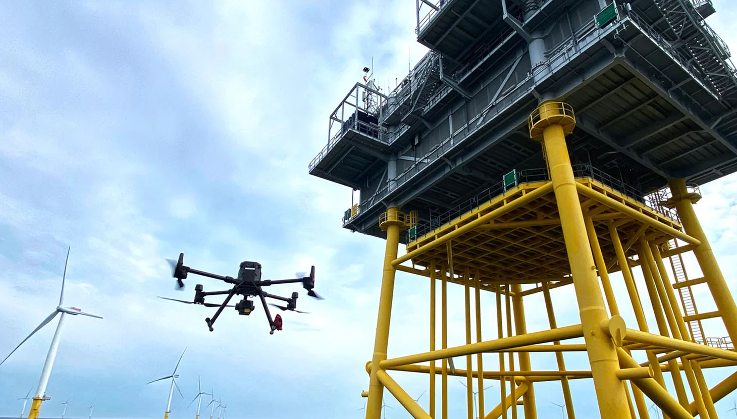 Drone in sky next to rig