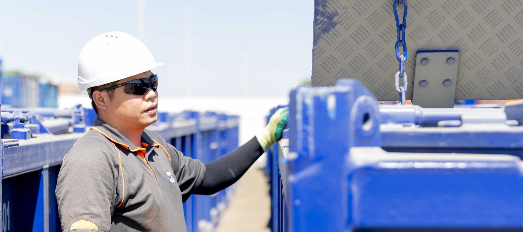 OEG Middle East worker next to a container unit