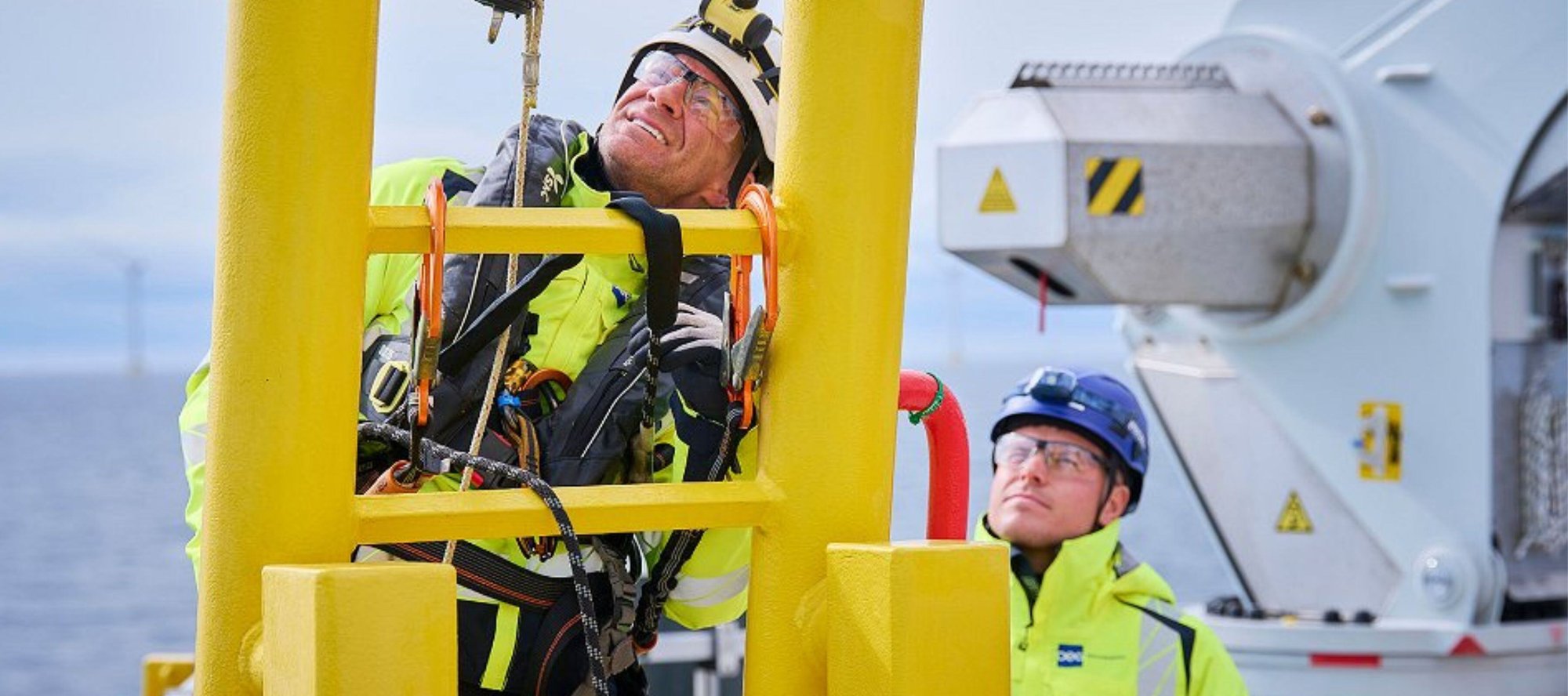 OEG engineers looking up ladder